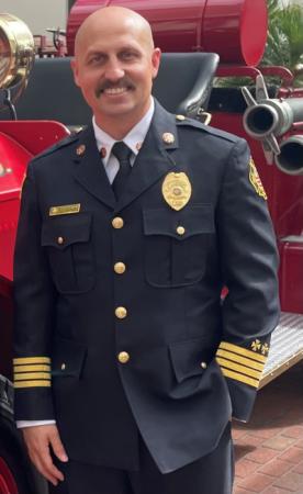 Assistant Fire Chief Ret Tompkins in uniform.