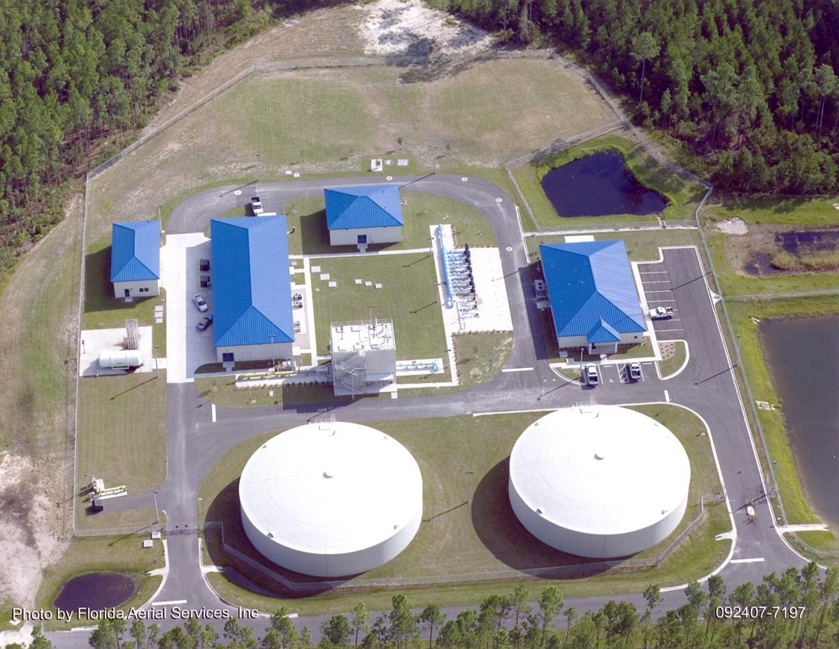 The Price Creek Water Treatment Plant, showing the entire facility, two big water tanks, 4 buildings with blue roofs